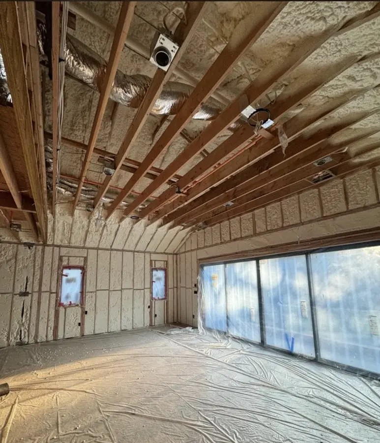 Interior walls and ceiling insulated with spray foam during new construction in Union Beach